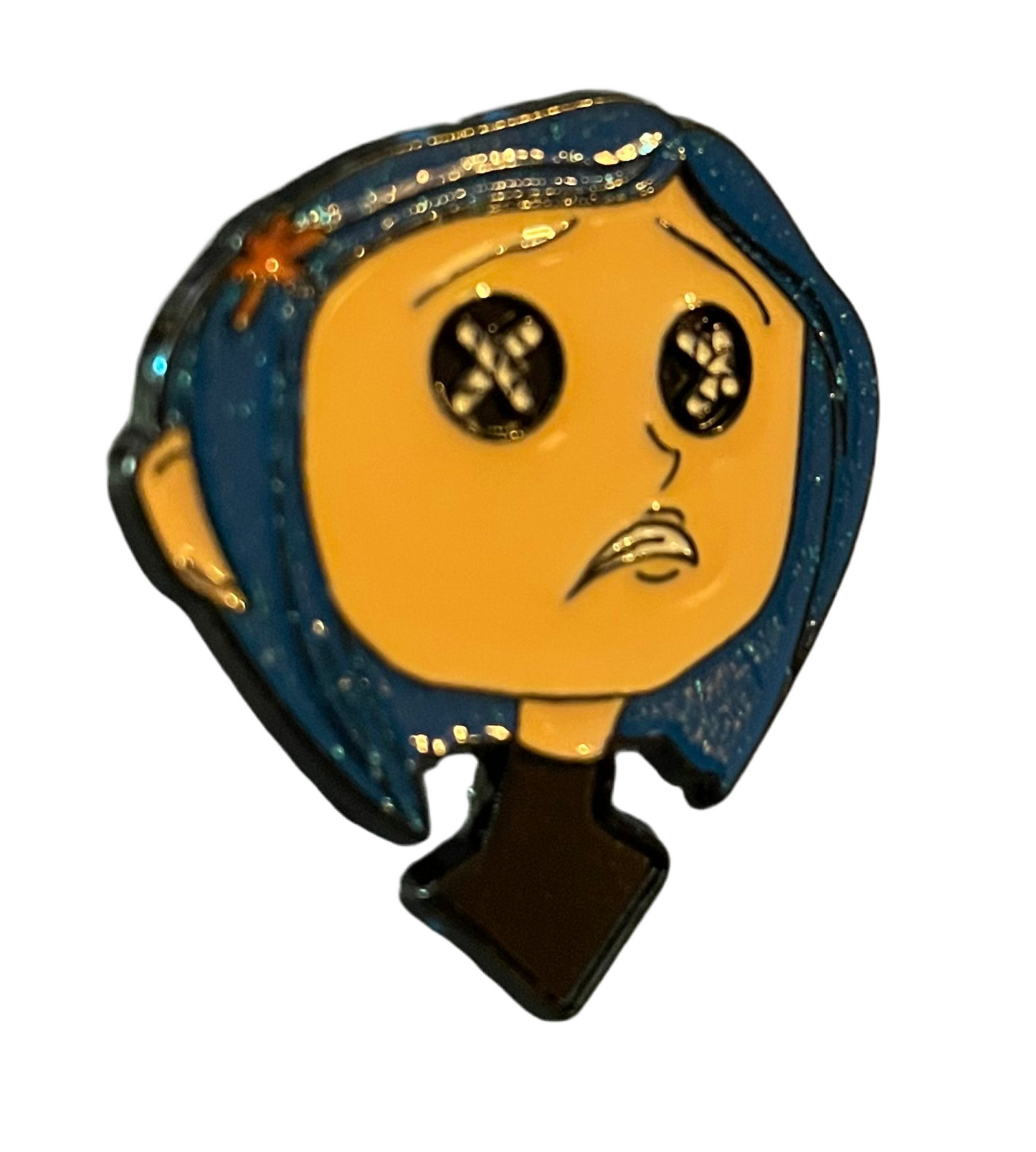 Coraline with black top pin badge
