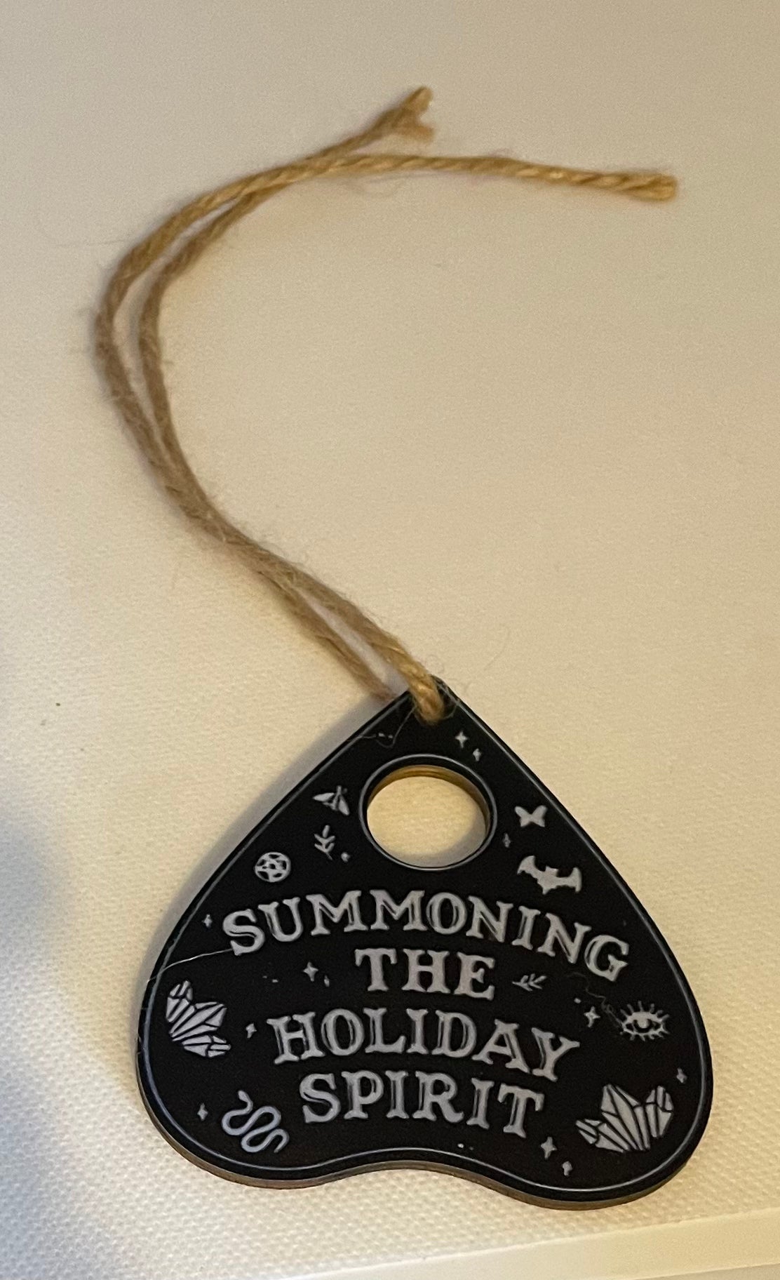 Summoning the Holiday spirit Black hanging ornament