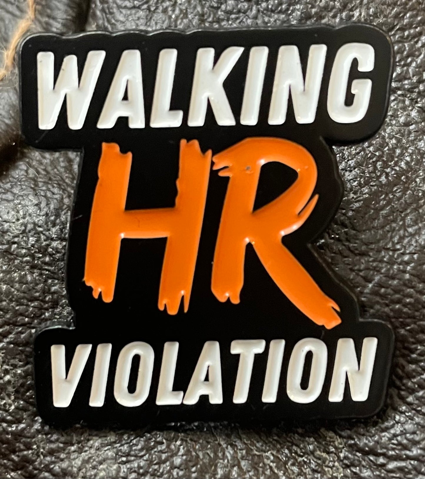 Walking HR violation pin badge