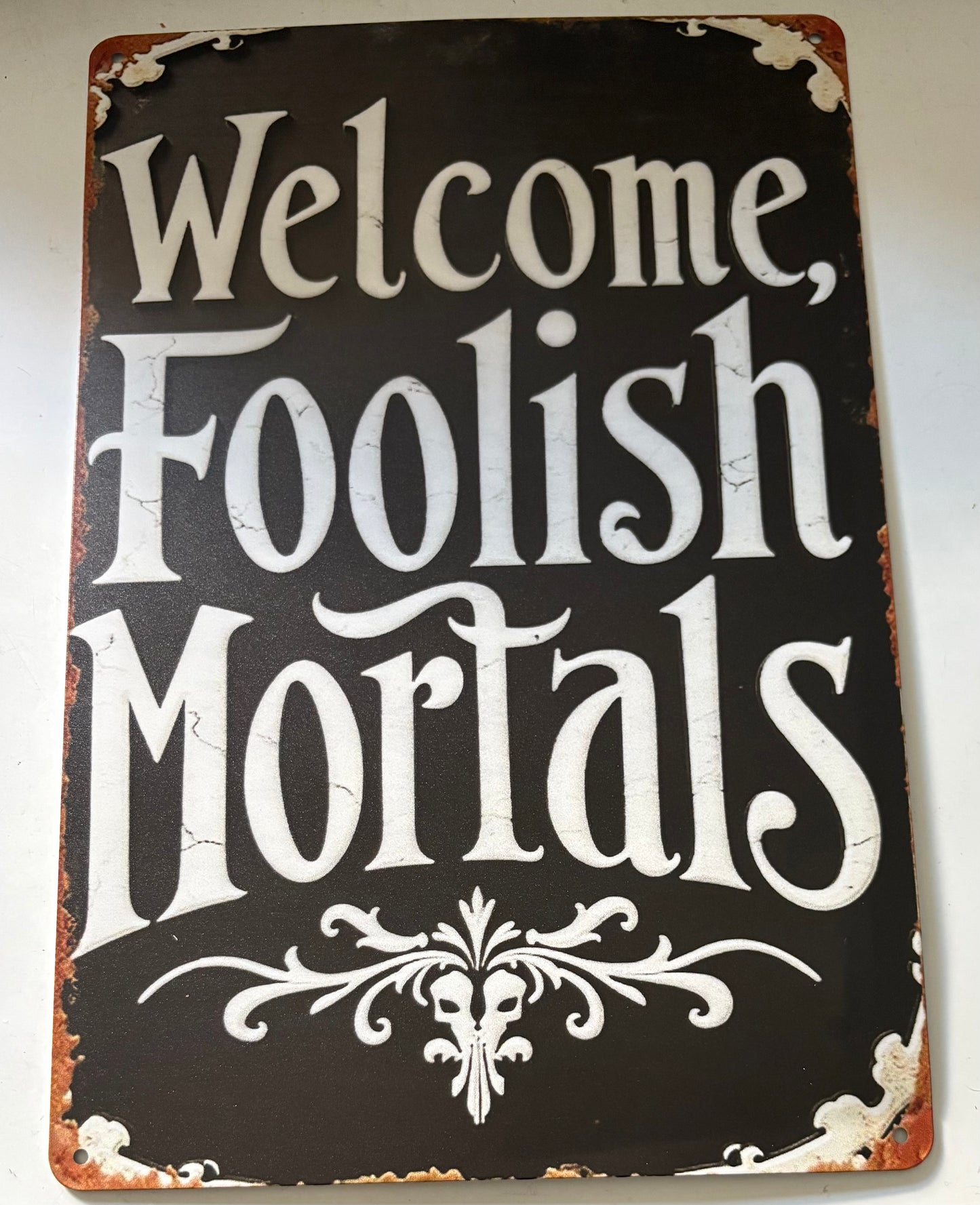 Welcome, Foolish Mortals sign