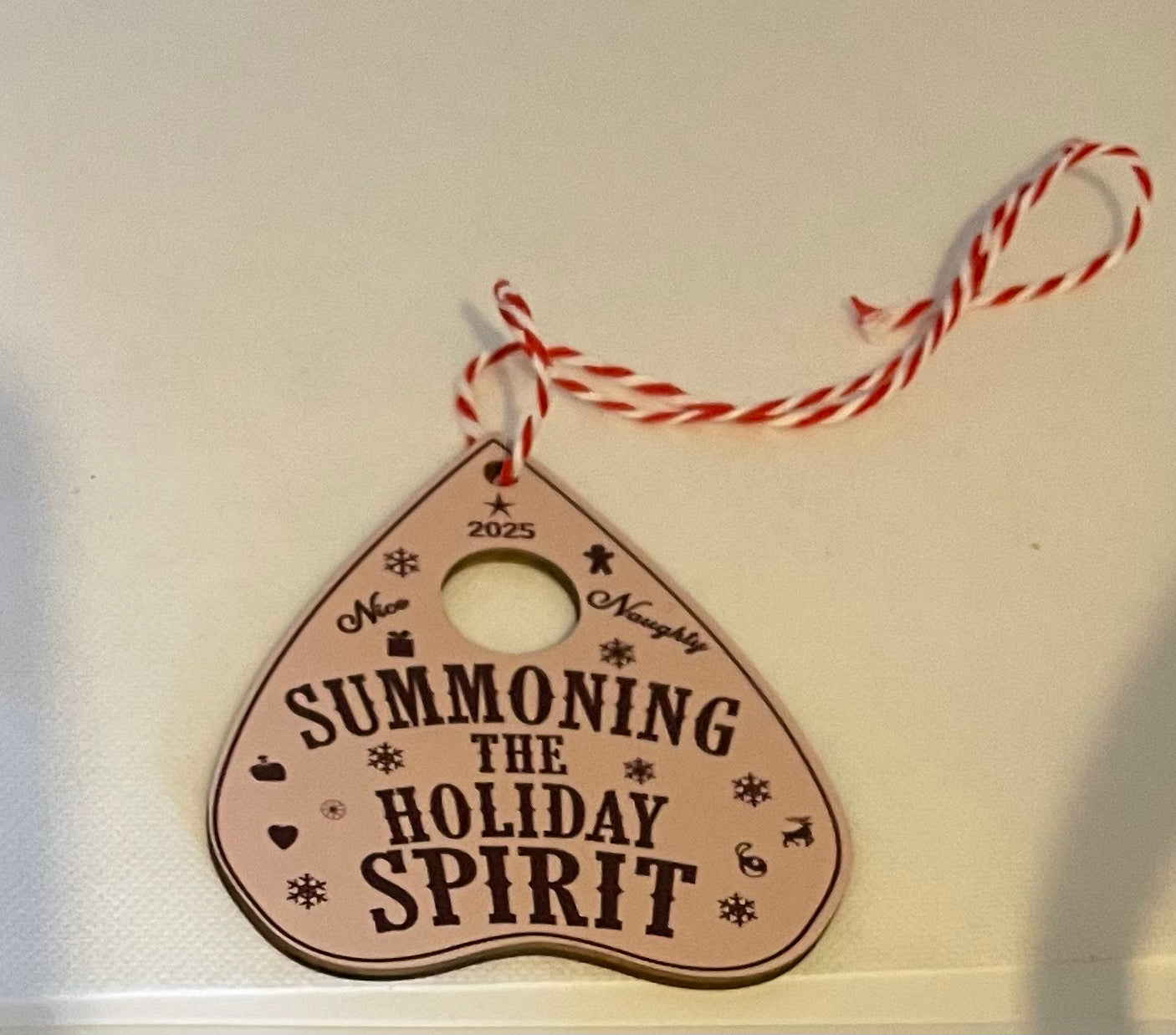 Summoning the holiday spirit white hanging ornament