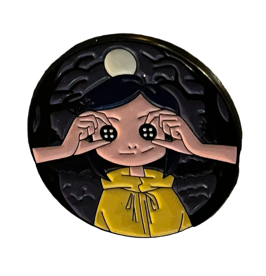 Coraline touching her eyes pin badge