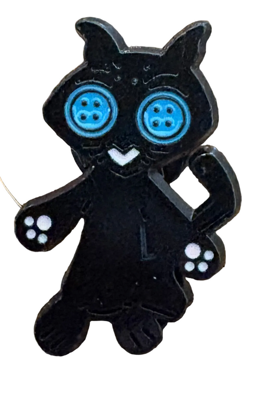 Coraline’s cat pin badge