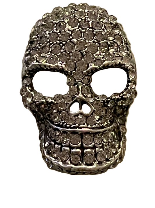 Glittering skull brooch